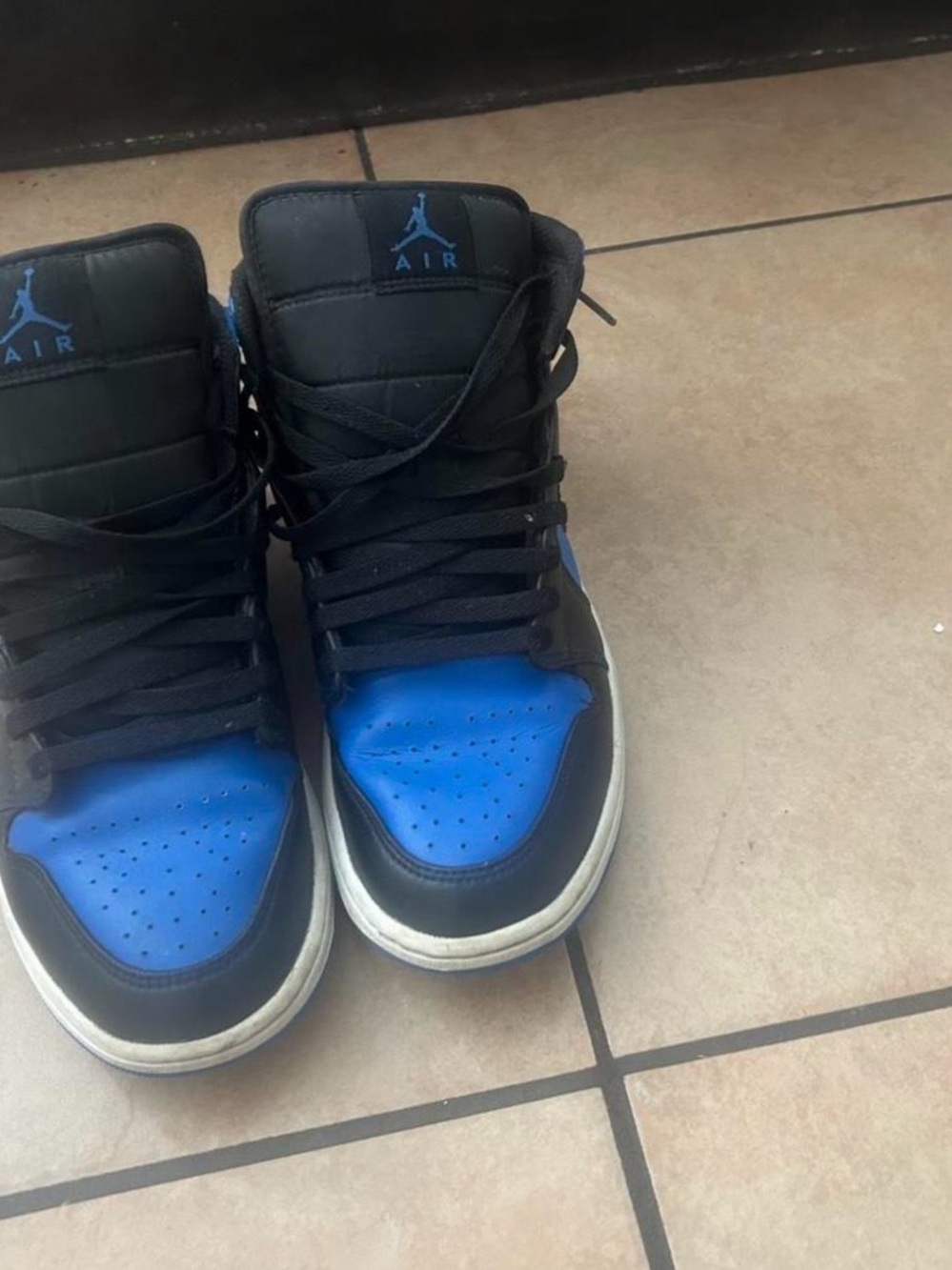 Jordan High-Top Sneakers in Black and Blue